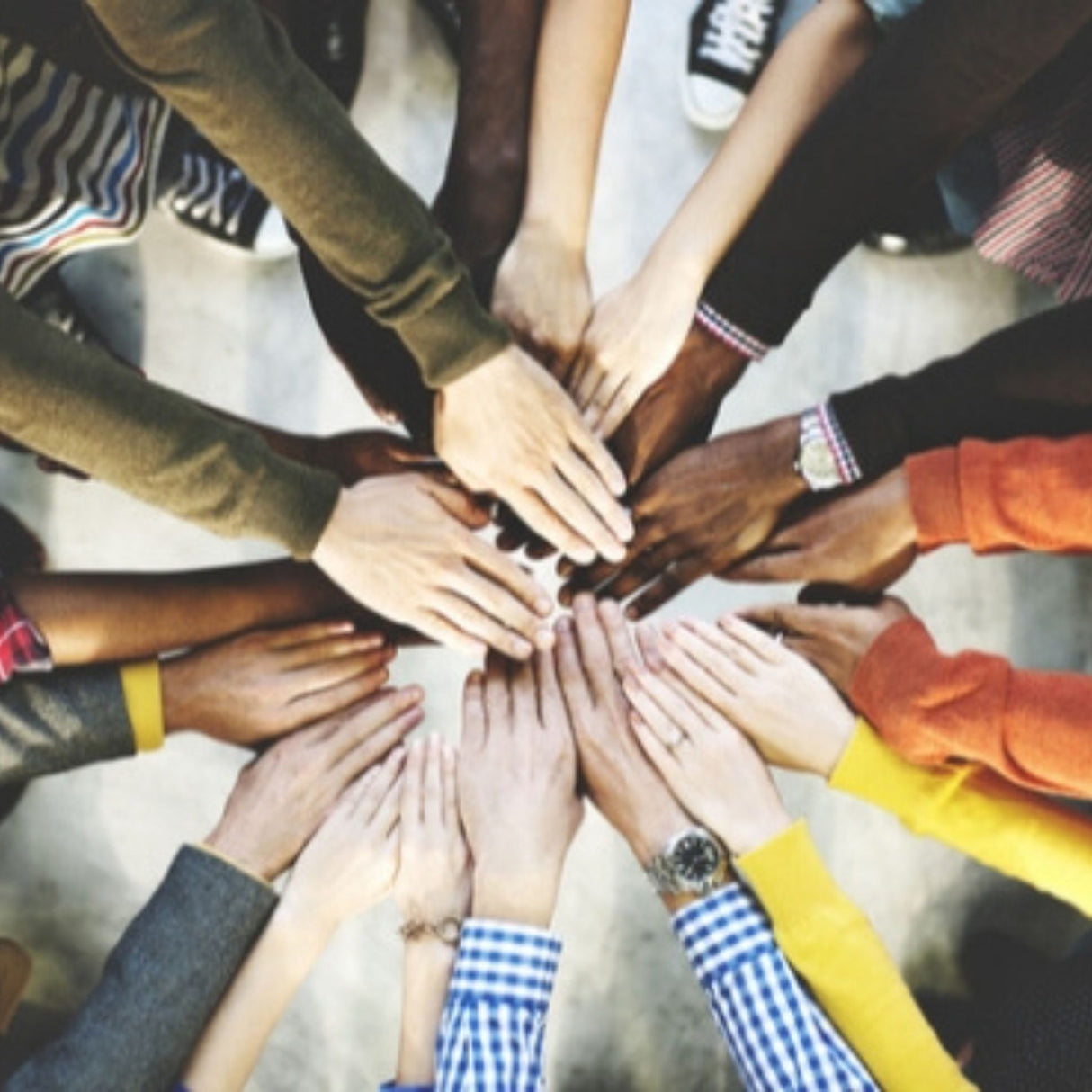 diverse hands together
