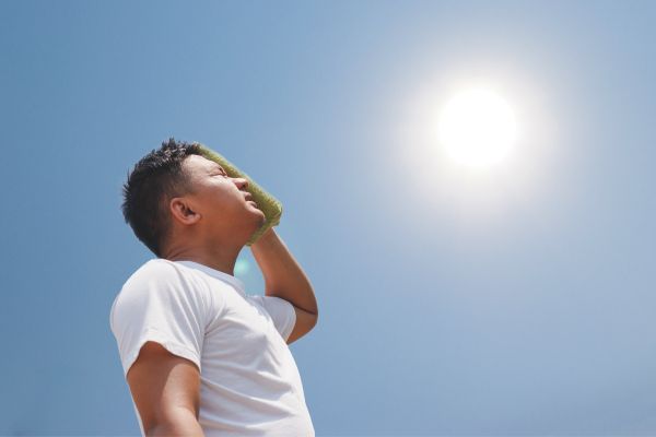 worker sweating in hot sun