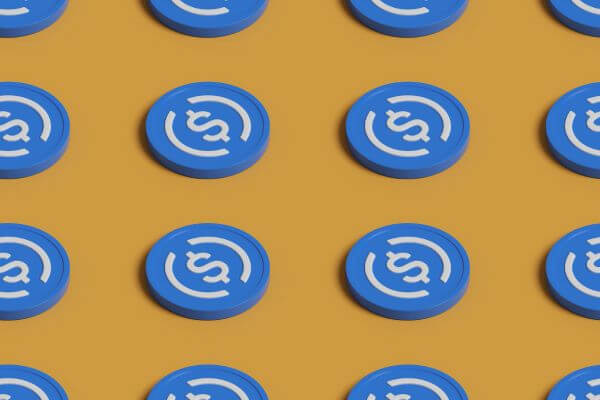 A repeating pattern of blue circular tokens with a white dollar-sign symbol, arranged in rows on a mustard yellow background.