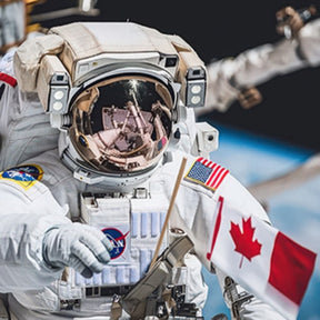 Astronaut in space with a Canadian flag and NASA logo visible