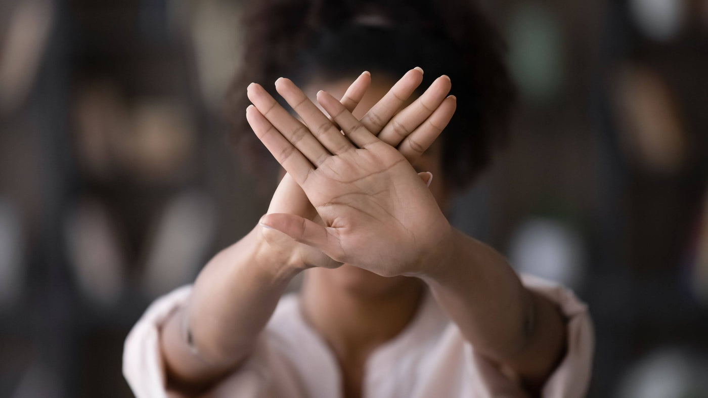 female hands symbolizing stop sexual harassment