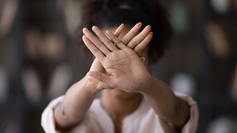 female hands symbolizing stop sexual harassment