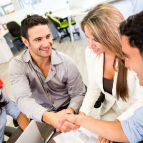 team members shaking hands