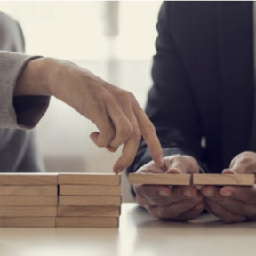managers moving board pieces