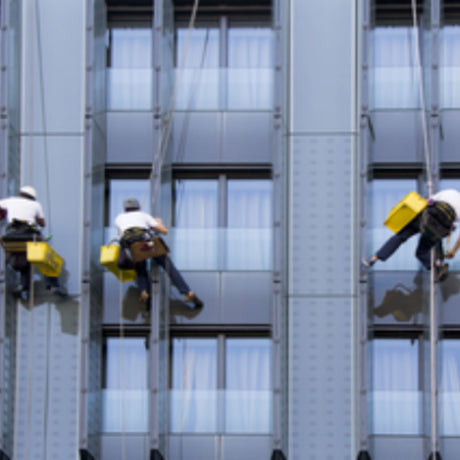 Three skyscrapper window cleaners